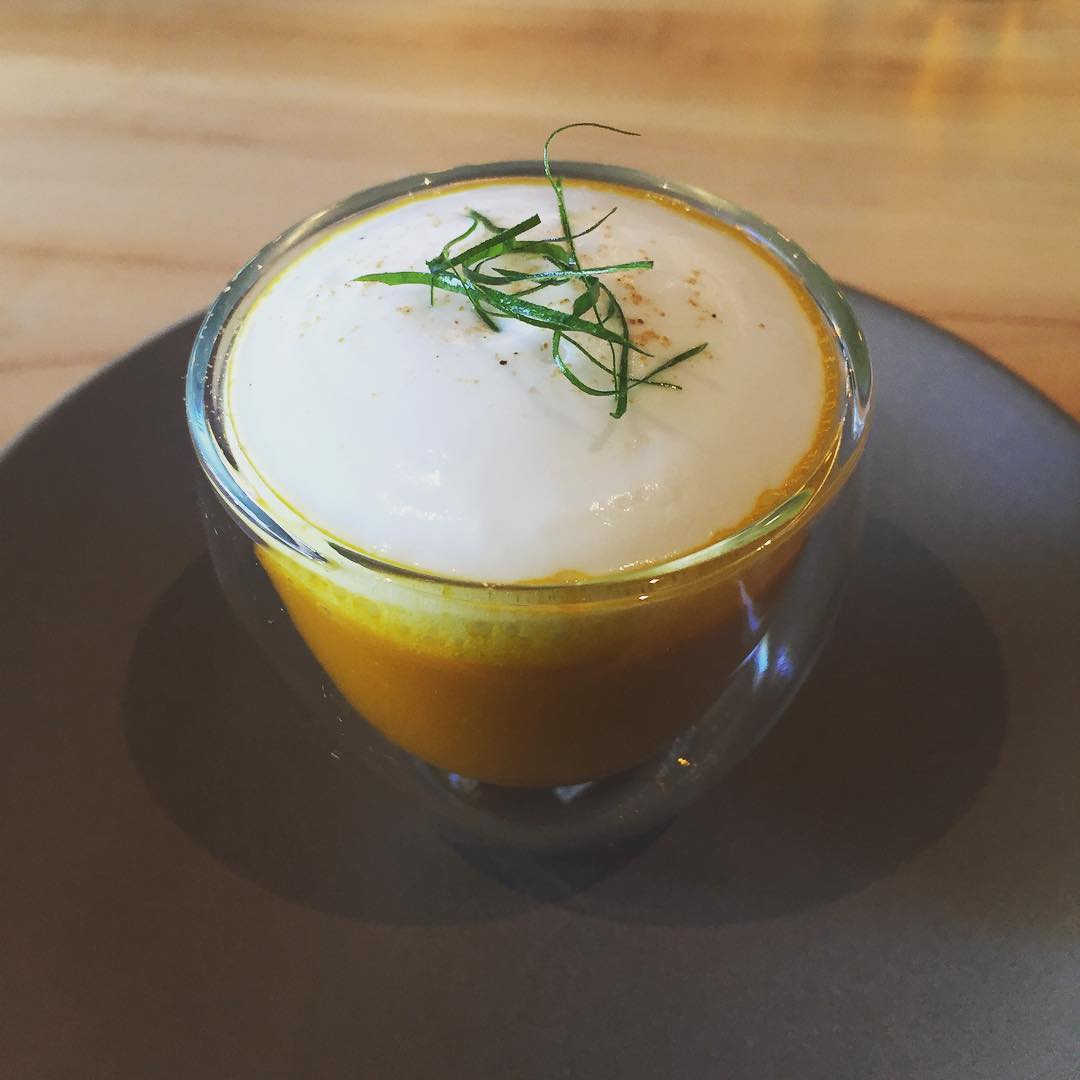 carmelized carrot soup with coconut foam and chaat masala