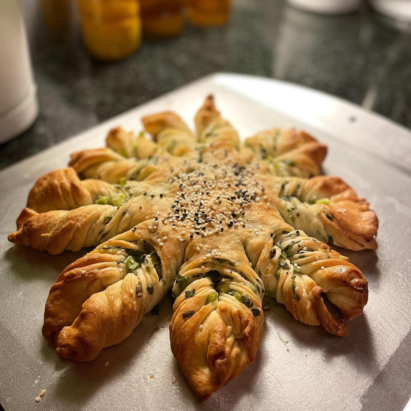 My first bread turned out to be this Scallion Bread shaped like a snowflake. Recipe courtesy of the fabulous @woon.heng. Growing up, one of my favorite foods was my Mom’s cong you bing, Cantonese scallion pancakes with layers of crunchy goodness. This has the same feeling but also tastes like a scallion croissant... delicious.